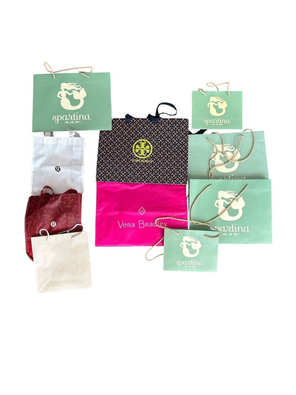 10 bags, 1 Swarovski, 2 LuLuLemon, 1 Tory Burch, 1 Vera Bradley, 5 Spartina